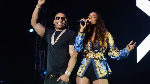 MIAMI GARDENS, FL - MARCH 15:  Musicians Nelly (L) and Kelly Rowland perform onstage during Day 1 of Jazz In The Gardens at Sun Life Stadium on March 15, 2014 in Miami Gardens, Florida.  (Photo by Larry Marano/Getty Images for Jazz In The Gardens)
