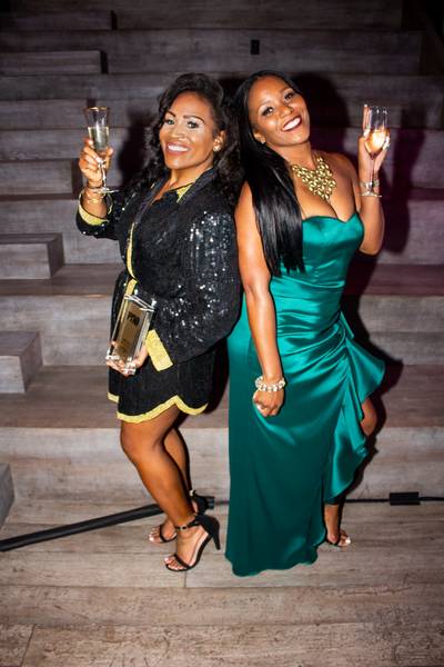Cheers! - Honorees Sasha Mitchell-Fuller (left) and Maja Sly (right) take a flick outside of the award ceremony! (Photo: Calvin Gayle @calvingproductions)