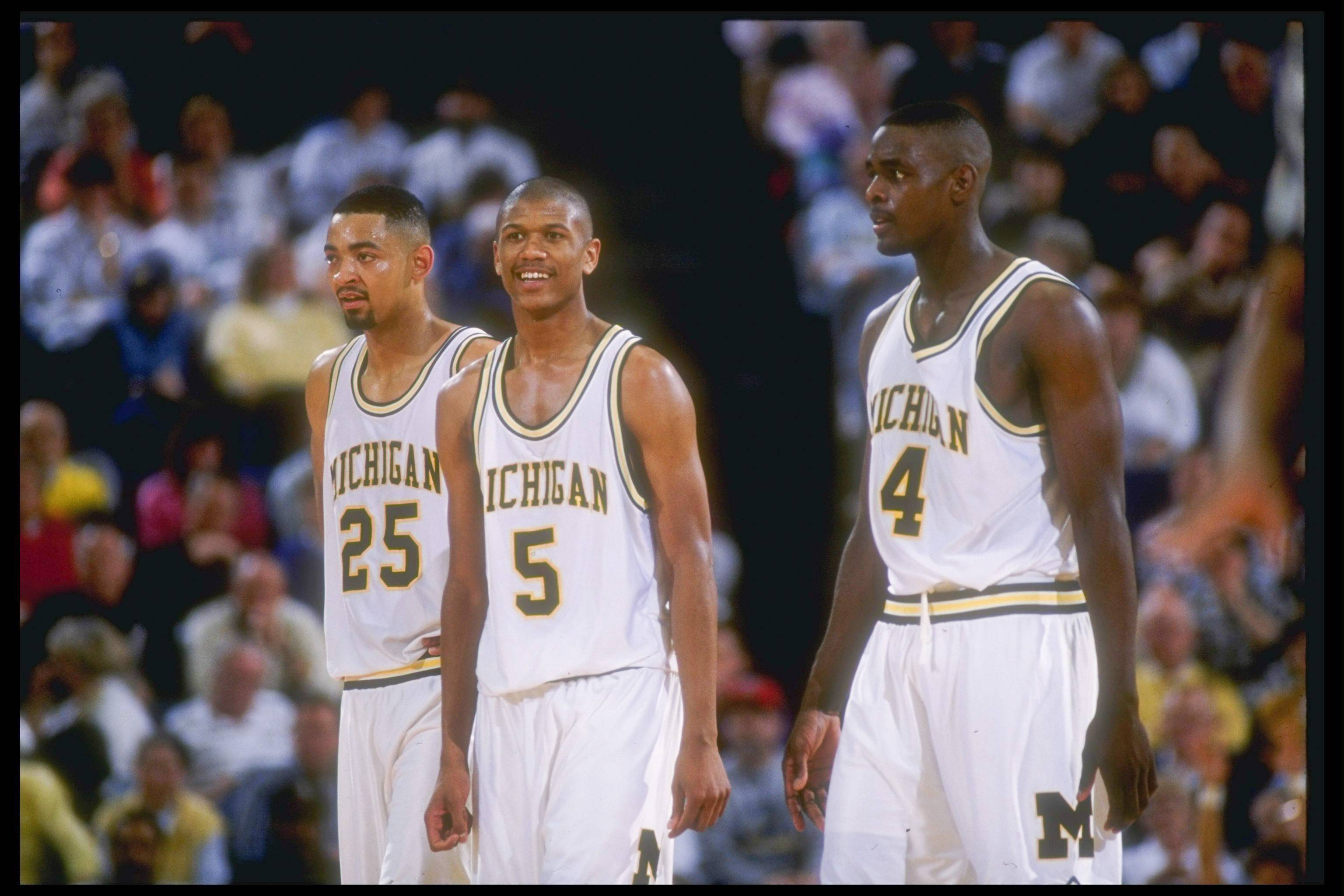 8 Mar 1992: Michigan Wolverines forward Juwan Howard, guard Jalen Rose, and forward Chris Webber (l to r) look on during a game against the Indiana Pacers.
