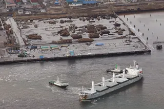 Tomakomai pier in Hokkaido is submerged after a ferocious tsunami unleashed by Japan's biggest recorded earthquake slammed into its eastern coasts. (Photo: AP Photo/Kyodo News)