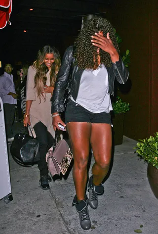 Just Say No - Girlfriends Serena Williams and Ciara tell the paps to back off by covering up while being photographed leaving dinner in Los Angeles. (Photo: INFphoto.com)