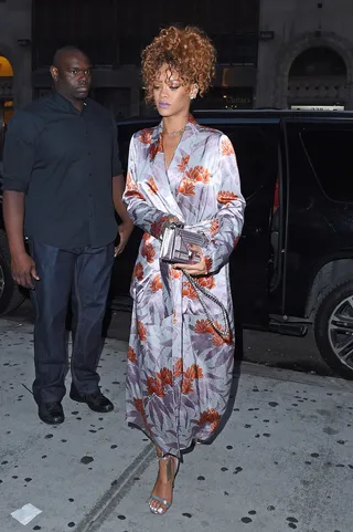 Love in the Air - Rihanna looks lovely in lilac and florals as she arrives to her stylist Sonya Benson's wedding reception at the American Whiskey Bar in NYC.(Photo: TS, PacificCoastNews)