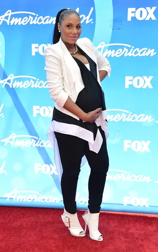 American Idol  - Tamar attends the American Idol 2013 finale in a stellar black and white BCBGMAXAZRIA Cyprien V-neck blouse with a Lloyd layered jacket. She paired that with J Brand jeans and fabulous Giuseppe Zanotti strapped peep-toe booties. Slay! (Photo: Frazer Harrison/Getty Images)