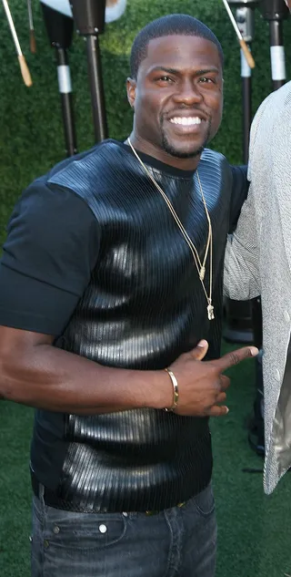 Kevin Hart - Kevin Hart cleans up well. The comedian flexes his muscular arms in a fitted tee featuring a striped leather panel.  (Photo: Maury Phillips/Getty Images for BET)
