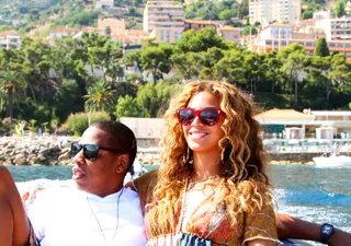 Feeling the Love - Beyoncé grins as she and Jay enjoy some chill time on the waterfront. Her smile says it all.(Photo: Courtesy of IamBeyonce)