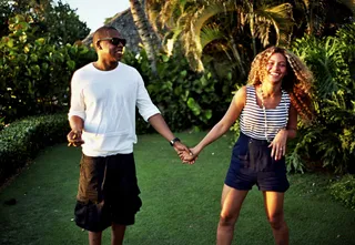 Joyful Moment - Beyoncé&nbsp;and&nbsp;Jay-Z share a special moment together as they hold hands and laugh together.   (Photo: Courtesy of IamBeyonce)