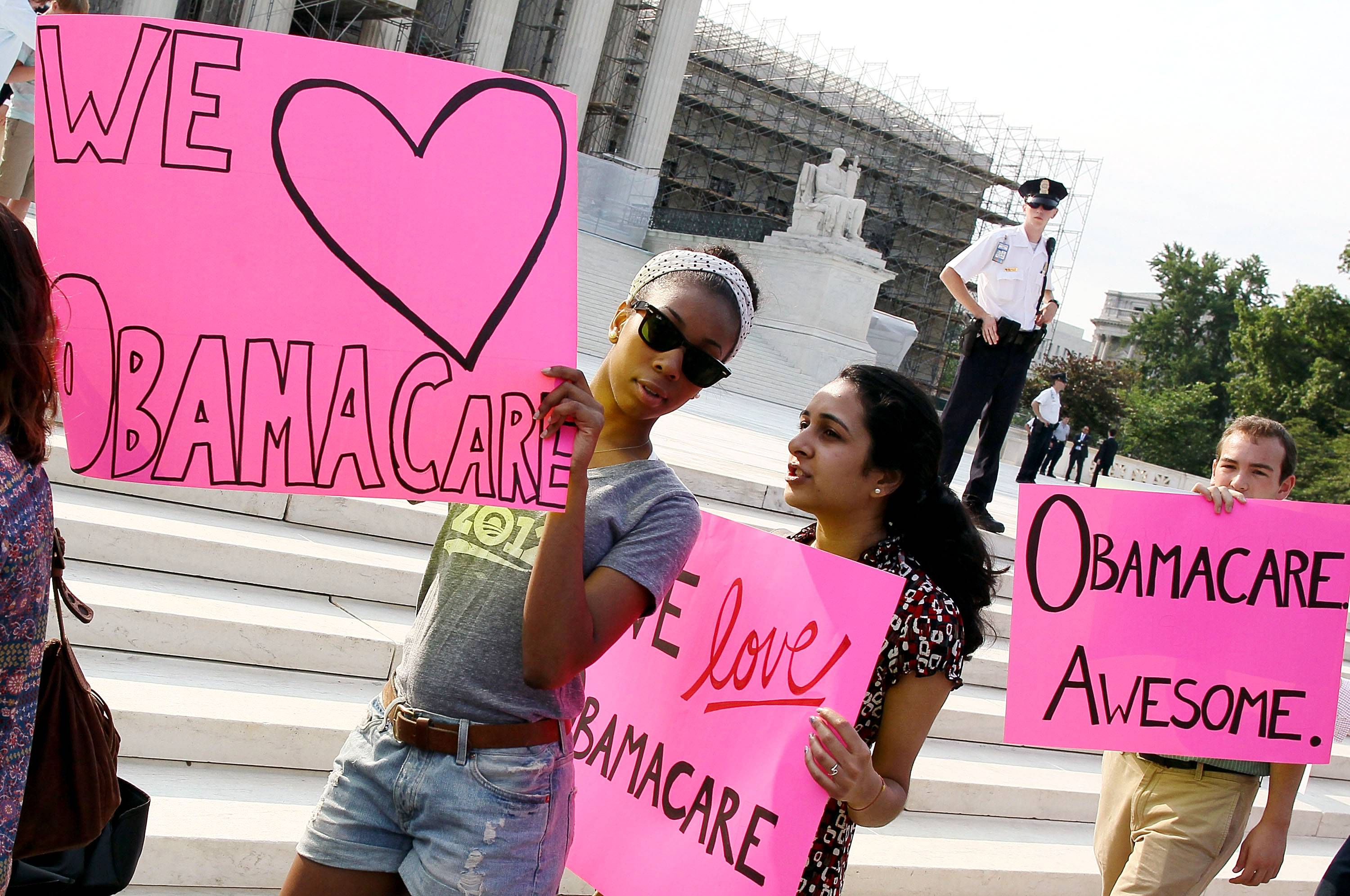 Both Sides of the Debate - Before the Supreme Court ruled 5-4 to uphold President Obama's Affordable Care Act, hundreds of demonstrators rallied in front of the courthouse in Washington on Thursday, some expressing their support and others their disapproval of the health-care law.&nbsp; – Britt Middleton&nbsp;(Photo: Mark Wilson/Getty Images)