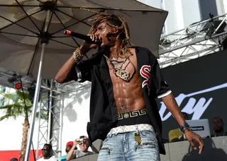 Fire in the Desert - Fetty Wap shows off his abs while performing on stage at Foxtail Pool at SLS Las Vegas.(Photo: Ethan Miller/Getty Images)