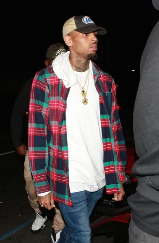 Plaid Dad - Chris Brown arrives to Warwick nightclub looking more ready for a turn down than a turn up rocking a Miller Lite trucker hat and a flannel shirt.(Photo: TwisT / SPW / Splash News)