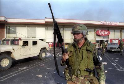 Curfew Instated&nbsp; - As the rioting intensified, a dusk-to-dawn curfew was imposed in large portions of the city. California National Guard troops were deployed to help keep control as L.A. police were unable and, in some cases, unwilling to battle the crowds.(Photo: REUTERS/Lou Dematteis)