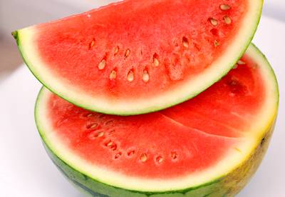 Watermelon - Watermelon is great for hydration, is rich in lycopene (also found in tomatoes), and has been proven to help lower high blood pressure. Not a fan? Try cantaloupe or other melons. They have great health benefits as well.&nbsp; (Photo: PA PHOTOS /LANDOV)