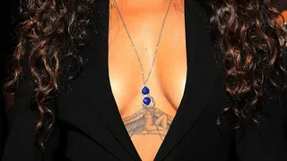 Pour It Up - The tattoo should be a dead giveaway as to which star this cleavage belongs to. (Photo: Paul Morigi/WireImage)