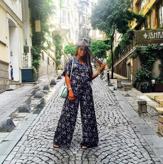 Tai Beauchamp - The fashion and beauty guru sports tail-length braids and a cute printed jumpsuit while touring Istanbul.   (Photo: Tai Beauchamp via Instagram)