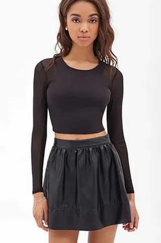 Leather Skirts - Leather skater skirts are perfect to pair with a tank for now and with a cropped sweater and tights later. This look was all over the festival. We found a super adorable (and super cheap!) one at Forever 21&nbsp;($17.80).  (Photo: Forever 21)
