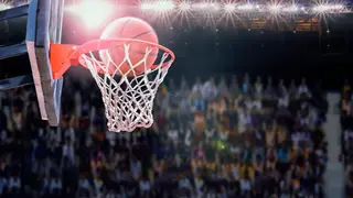 basketball scoring during match in arena