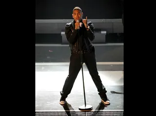Chris Brown Gets Into His Performance - Mic stands make great stage props.