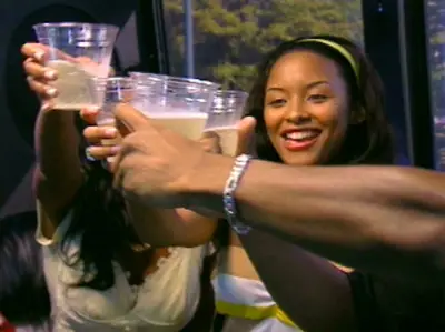 Cheers! - The housemates toast to their new adventure.