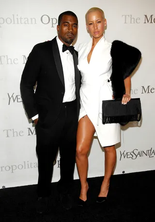 The Evolution of Kanye West - In 2008, Yeezy introduced the world to bald, blonde beauty Amber Rose, his girlfriend at the time. Though they split in 2010 — and she's now engaged to Wiz Khalifa — Yeezy and Rose made a huge splash.  (Photo: Rob Loud/Getty Images)