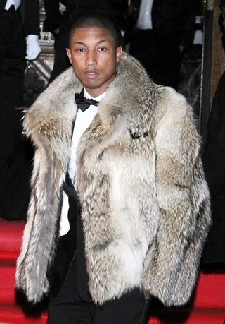 From Russia With Love - Pharrell bundles up in style for the Dolce & Gabbana gala at the Italian Embassy in Moscow. (Photo: WENN.com)