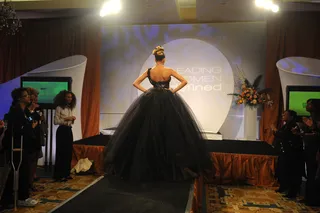Queen of the Ball - A model's dramatic Black ball gown grabs all of the attention during the fashion show.   (Photo: Brad Barket/PictureGroup)