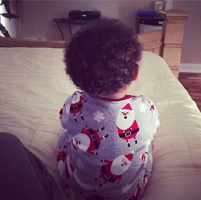 Amber Rose  - We’re thinking Amber’s son, Sebastian, is taking after her sense of style. Just take a look at his Santa pajamas. Too cute! (Photo: Amber Rose via Instagram)