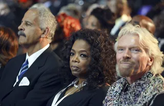 Oprah Joins in Honoring Madiba - Oprah Winfrey and Stedman Graham sit beside British entrepreneur Richard Branson at the ceremonies for former South African President Nelson Mandela in Qunu. (photo: REUTERS/Odd Andersen/Pool)