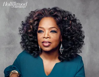 Oprah - The media mogul gives her strands a holiday update with pretty brown highlights and glam curls.   (Photo: The Hollywood Reporter, December 2013)