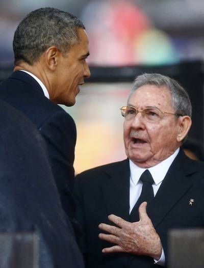 Diplomatic Immunity - Obama greets Cuban President Raul Castro before giving his speech at the memorial service for late South African President Nelson Mandela despite their two nations' more than half-century-old rift, which angered Cuban-American lawmakers in the U.S. (Photo: REUTERS/Kai Pfaffenbach)