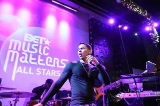 For the People - Adrian Marcel gets into it and the crowd responds. The up-and-coming crooner had a big 2013 and is looking to enjoy an even bigger 2014.(Photo: Bennett Raglin/BET/Getty Images for BET)