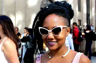 Retro Wonder - Luiza rocks her kinky-twists in a sassy updo with some long bangs framing the side of her face. We love the retro vibe she creates with these Tom Ford cat-eye sunglasses.  (Photo: Britt Middleton/BET)