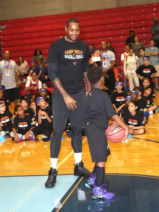 One on One - Carmelo Anthony shoots hoops with a talented young player at his Citi Melo Youth Fantasy ProCamp at Baruch College in New York City.&nbsp;(Photo: Derrick Salters/WENN.com)