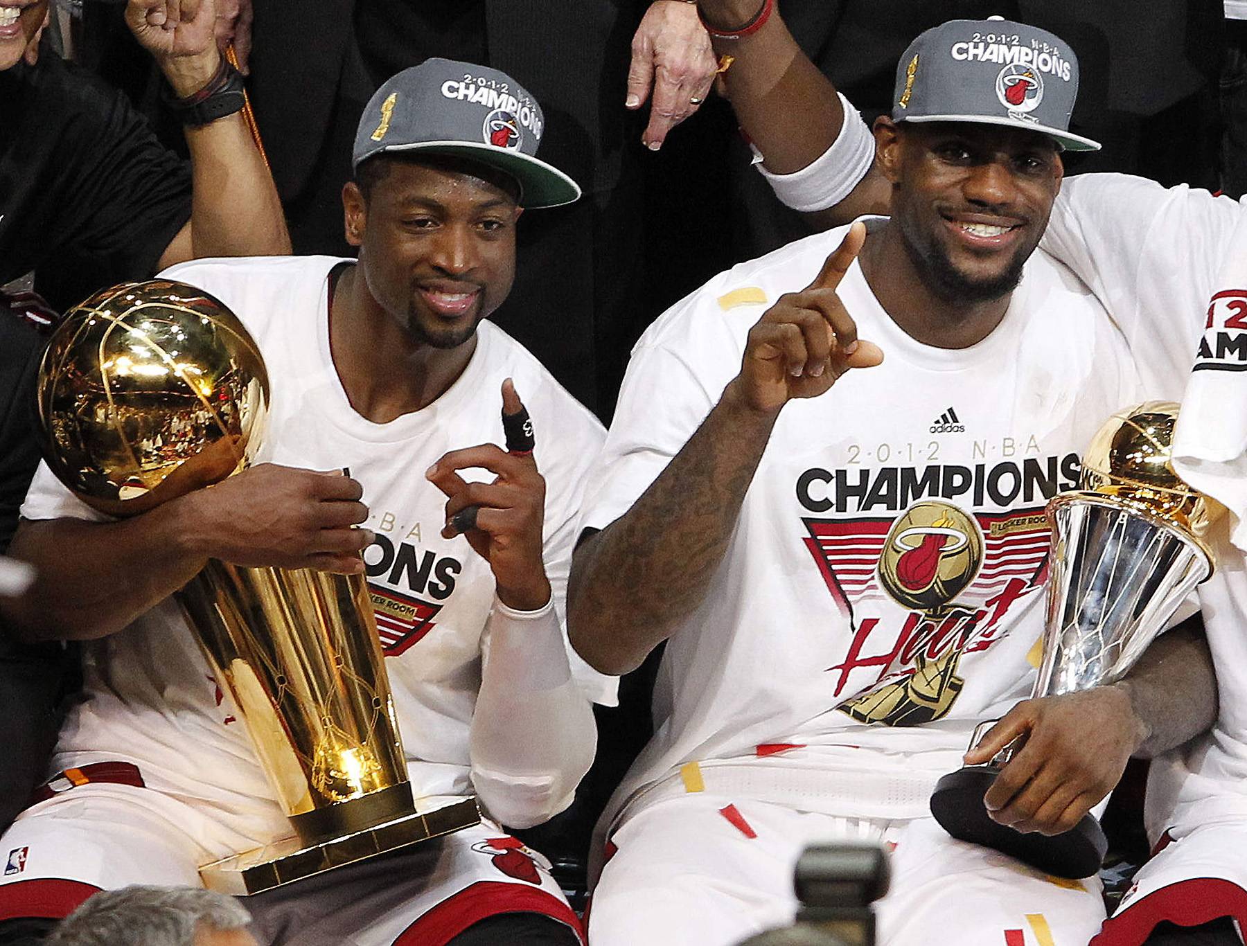 Just the Two of Us - The Heat's Wade cradles the Larry O'Brien NBA Championship Trophy alongside James, who was named game MVP. (Photo: AP Photo/Lynne Sladky)