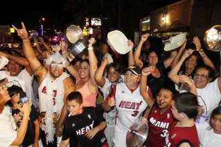 Let's Go Crazy - Miami Heat fans let loose in the Little Havana neighborhood of Miami following the team's win. (Photo: AP Photo/Alan Diaz)