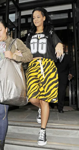 Wild Gyal - Rihanna was spotted rocking tiger print shorts and a cropped NFL jersey while leaving her hotel in London.   (Photo: Optic Photos, PacificCoastNews.com)