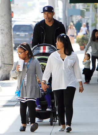 Caron Butler - Los Angeles Clippers star Caron Butler enjoys a stroll with wife Andrea and his daughters.(Photo: FameFlynet Pictures)