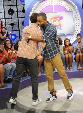 Hugs - Andy Samberg and Terrence J on 106 &amp; Park, June 14, 2012. (Photo by: Dane Delaney / BET)