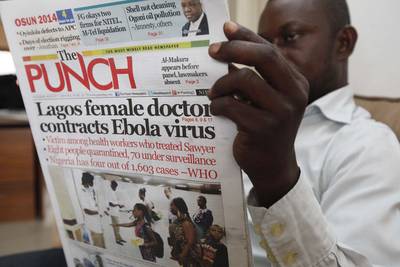 Nigeria Confirms 1 Ebola Death, 5 Cases - On Aug. 6, Nigeria?s health minister announced that a local nurse who treated Patrick Sawyer, a 40-year-old American of Liberian descent, with Ebola is now dead and five others are now infected with the virulent disease. Sawyer was traveling on a business flight to Nigeria last month when he fell ill. (Photo: AP Photo/Sunday Alamba)