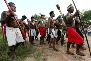 Amazon Tribe Makes First Contact With Outside World - Drug dealers allegedly launched a murderous attack that prompted tribesmen of the Peruvian rainforest to seek help from the outside world&nbsp;on&nbsp;the border of Brazil. A video shows seven naked tribesmen on the banks of the Envira River. The men allegedly asked for weapons and allies. Other isolated tribes have been seen in recent years at the Peru-Brazil border.&nbsp;(Photo: Mario Tama/Getty Images)