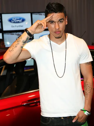 A True Salute - Recording artist Adrian Marcel gives a nod to awesome cars. In this case the Ford Fusion is that vehicle.(Photo: Maury Phillips/BET/Getty Images)