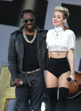 Going Bold - Miley Cyrus is ready to break the mold with her new album and new look. Here's the former Disney child star performing with Will.i.am at Jimmy Kimmel Live! in Los Angeles. (Photo: Clint Brewer / Splash News)