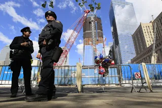 On Alert - New York City police officers stand guard outside Ground Zero.(Photo: AP Photo/Mary Altaffer)