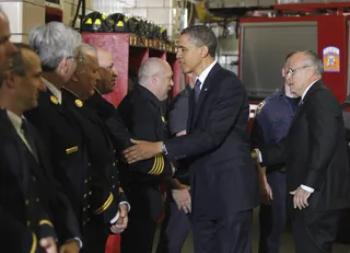 Giving Thanks\r - The president and former New York City Mayor Rudy Giuliani meet with firefighters and first responders.\r(Photo: AP Photo/Charles Dharapak)