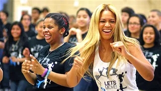 Get a Move On - Beyoncé busts a move with students during a surprise visit to PS 161 Middle School in Harlem, N.Y., as a part of the First Lady’s “Let’s Move Flash Workout” campaign.(Photo: Fame Pictures, Inc)