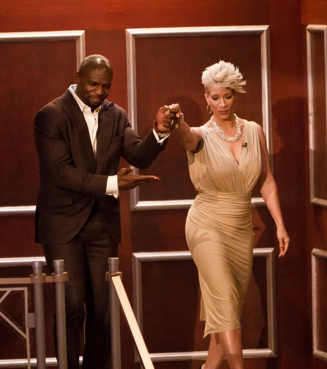 Chivalry Is Not Dead - Terry Crews helps his wife, Rebecca, down the stairs into the Penthouse.&nbsp;(Photo: Darnell Williams/BET)