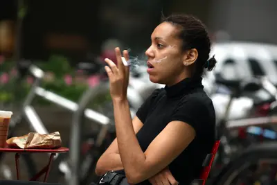 No Smoking Outdoors - Think twice before you want to light up a cigarette on a nice stroll through an NYC park, because in 2011 it became punishable with a $50 fine to smoke at city parks, beaches and pedestrian plazas, including Times Square.(Photo: Daniel Barry/Getty Images)