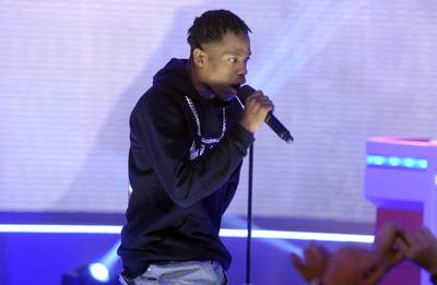 Words Spell - Travi$ Scott lets the rhymes flow while on the 106 stage.&nbsp;(Photo: John Ricard/BET/Getty Images for BET)