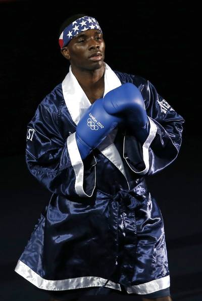 U.S. Olympic Boxer Blasts Zimmerman Verdict - Joining the ranks of professional athletes speaking out against George Zimmerman's not guilty verdict,  U.S. Olympic boxer Terrell Gausha called Zimmerman's acquittal &quot;a slap in the face.&quot; Gausha, who represented the U.S. at the 2012 London Games, told TMZ he will no longer wear the American flag on his boxing shorts in protest, adding, &quot;How can I wear my stars and stripes proudly in a country where they make a big deal out of Mike Vick fighting dogs; but not a young innocent Black male's life.&quot; (Photo: REUTERS /MURAD SEZER /LANDOV)
