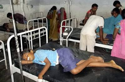 Contaminated School Meals Kill 22 Children in India - School lunch meals possibly contaminated with insecticides killed 22 children in one of India’s poorest states. Forty-eight children who had also eaten the contaminated food were being treated in Patna. Dozens of protesters stormed the local police station, blaming the government for not hospitalizing the children quickly enough.  (Photo: AP Photo)