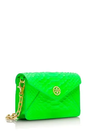 Neon Snake Crossbody - This hot-hued chain purse is a simple accessory with enough color to bring edge to the simplest look. Pair it with head-to-toe white and delicate gold jewels. (Photo: Tory Burch)&nbsp;
