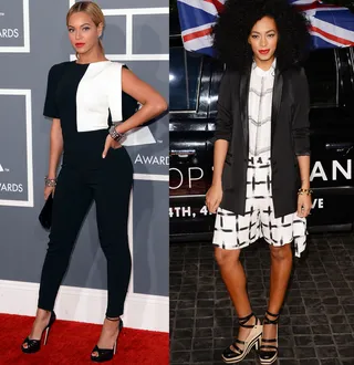 Black and White - The sisters look chic in simple black and white. Bey flaunts her curves in a colorblock jumpsuit while Solange picks a more playful mixed print ensemble.  (Photos: Jason Merritt/Getty Images)